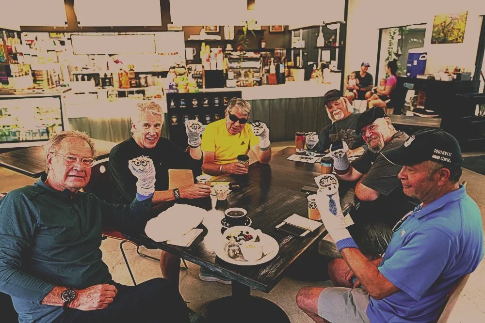 People gathered around a table in a cafe